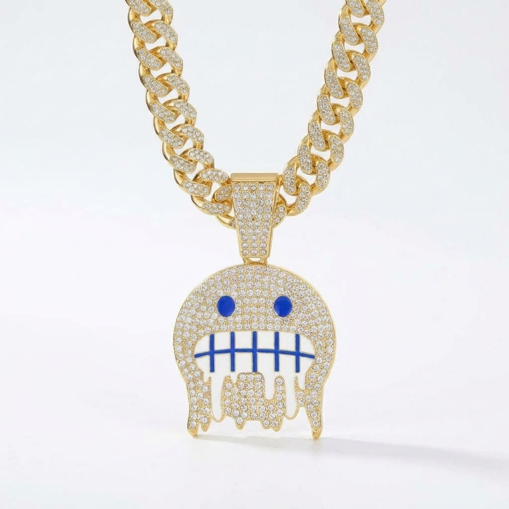 Iced Out Frozen Drip Emoji Pendant Necklace on Cuban Link Chain – Grimacing Face with Blue Enamel Eyes | Gold or Silver