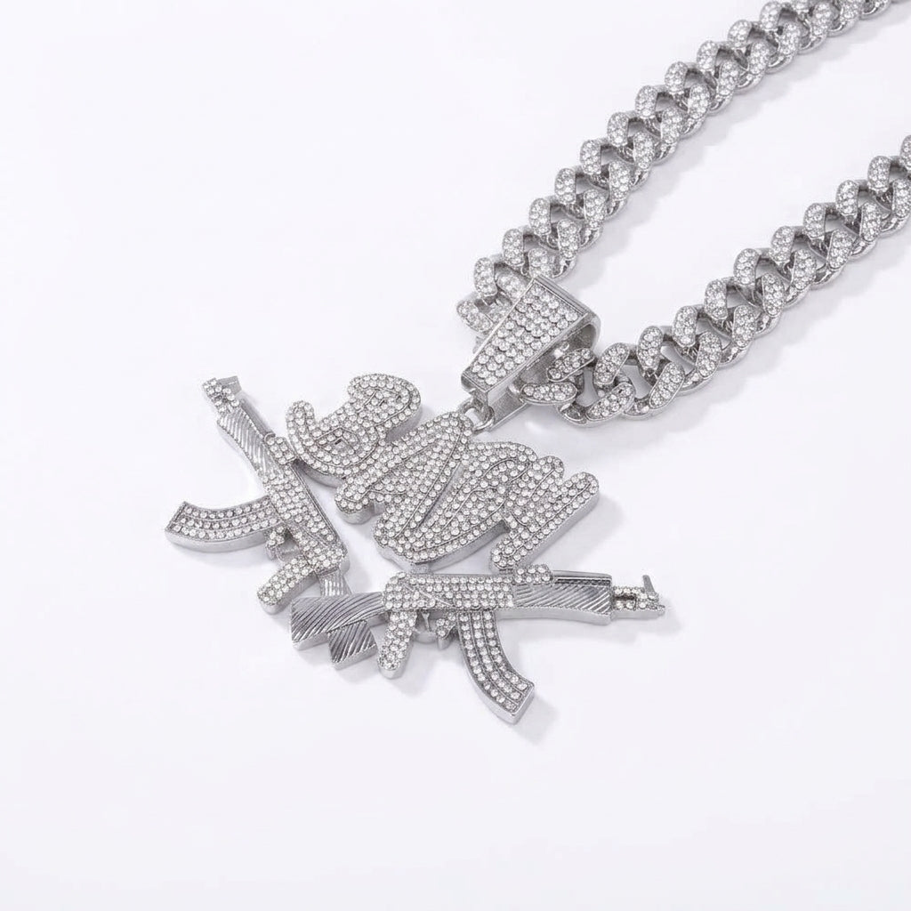 Iced Out Crossed Rifles Pendant Necklace on Cuban Link Chain – BABY Script Lettering | Gold or Silver